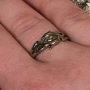 SILVER COLORED DOLPHIN RING.